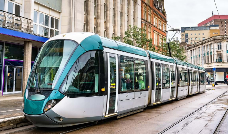 Nottingham's city tram makes a stop at Old Market Square.