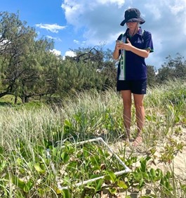 Unity College student using Survey123 to collect field data