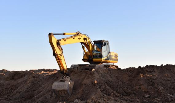 An excavator digging on a construction site