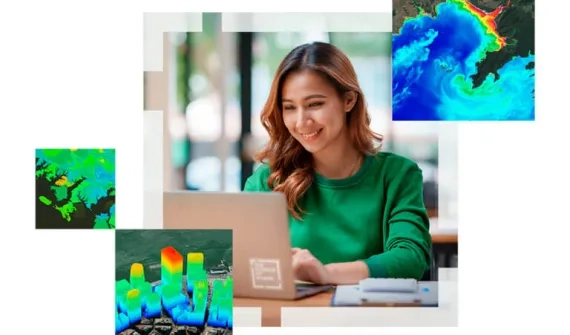 Woman in green jumper at laptop