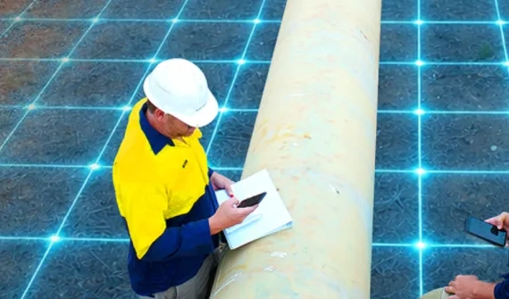 Two construction workers in the field