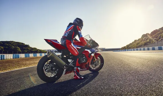 Person on red Honda motorcycle