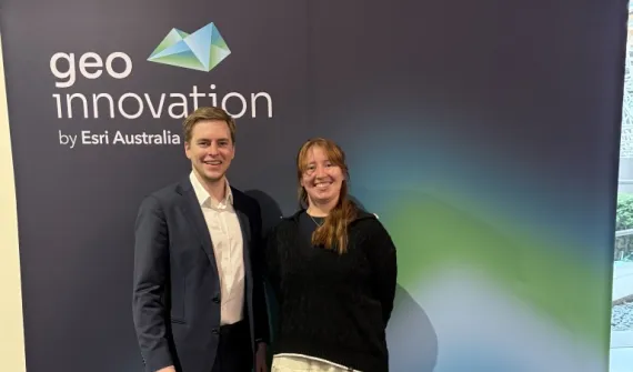 EYSA 2026 Winner Lucy Hughes and Alex Reece standing in front of a Geoinnovation sign