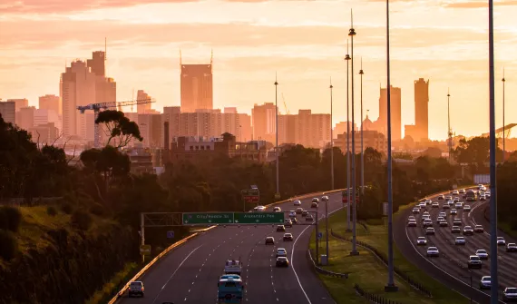City skyline and road with cars